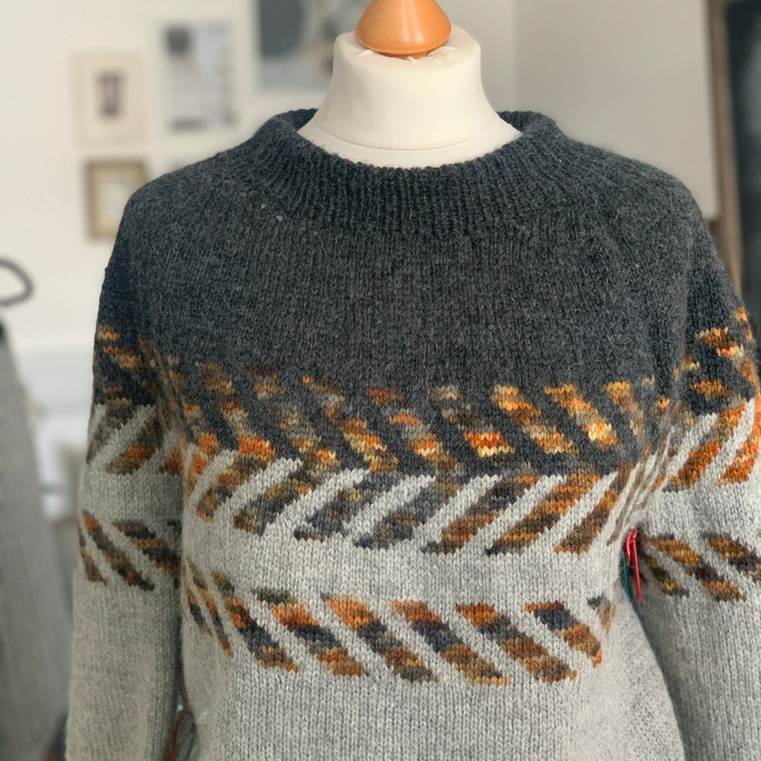 SHALE knit pattern by Jo Storie , using BareFaced Yarn. Worked from the bottom up on circular needles. The Sleeves and body are worked in the round to the underarm and then joined to form the yoke.